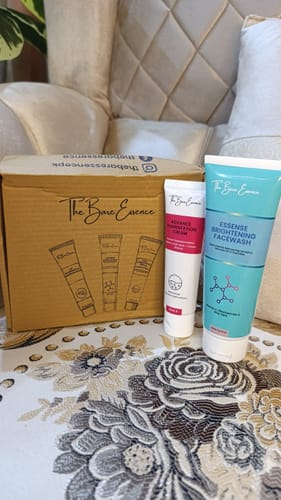 Customer's Eco Pigmentation Bundle, showing the facewash and cream tubes displayed in front of their box on a floral surface.