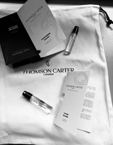 Customer's Lilium Blume Eau de Parfum sample with elegant packaging and two free samples on a branded cloth pouch.