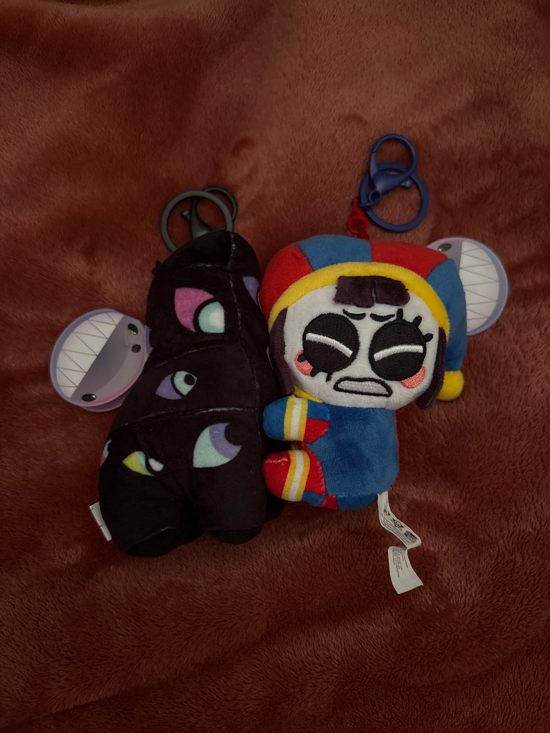 Customer photo review of Pomni & Abstraction Magnetic Plush Keychains
