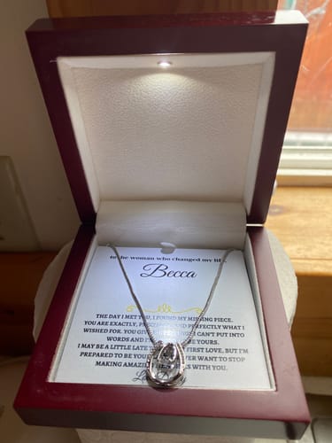 Customer's beautiful gift set with the silver necklace inside the open, lighted mahogany box.