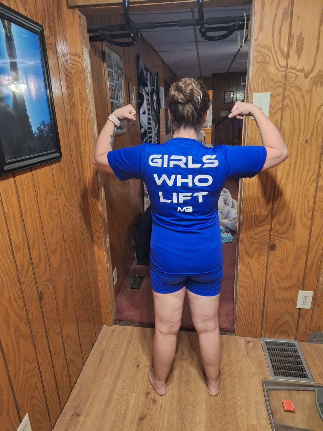 Customer photo review of "Girls Who Lift" Performance Unisex Tee