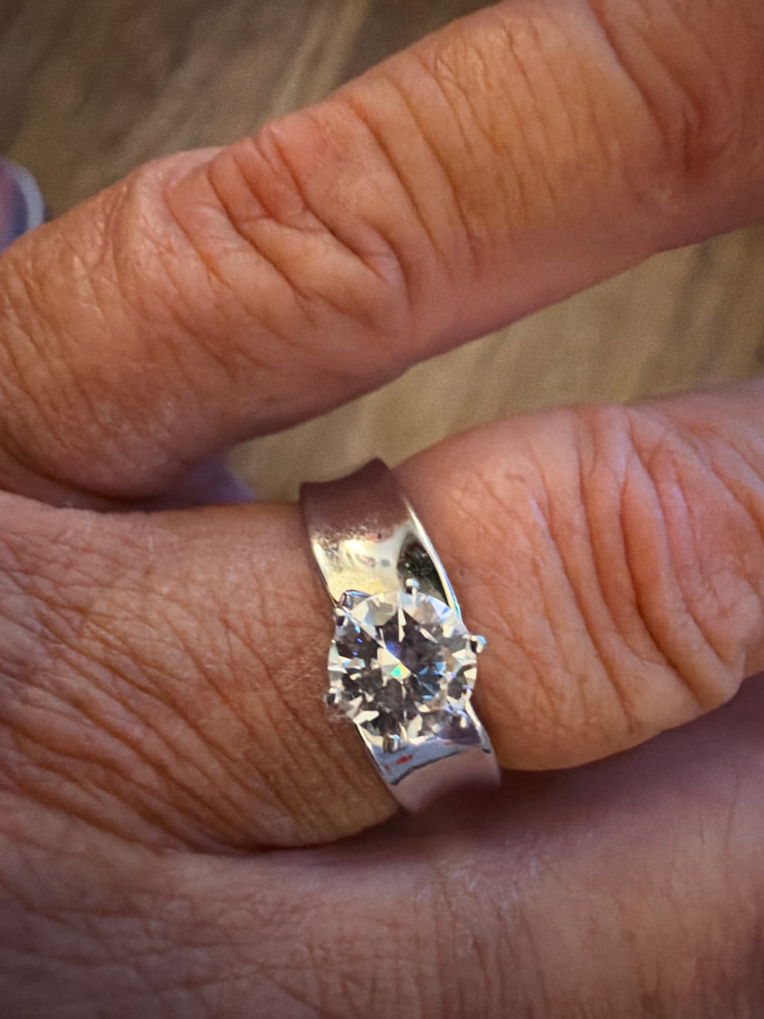 Customer photo review of Solitaire Round Moissanite Concave Wide Band Engagement Ring