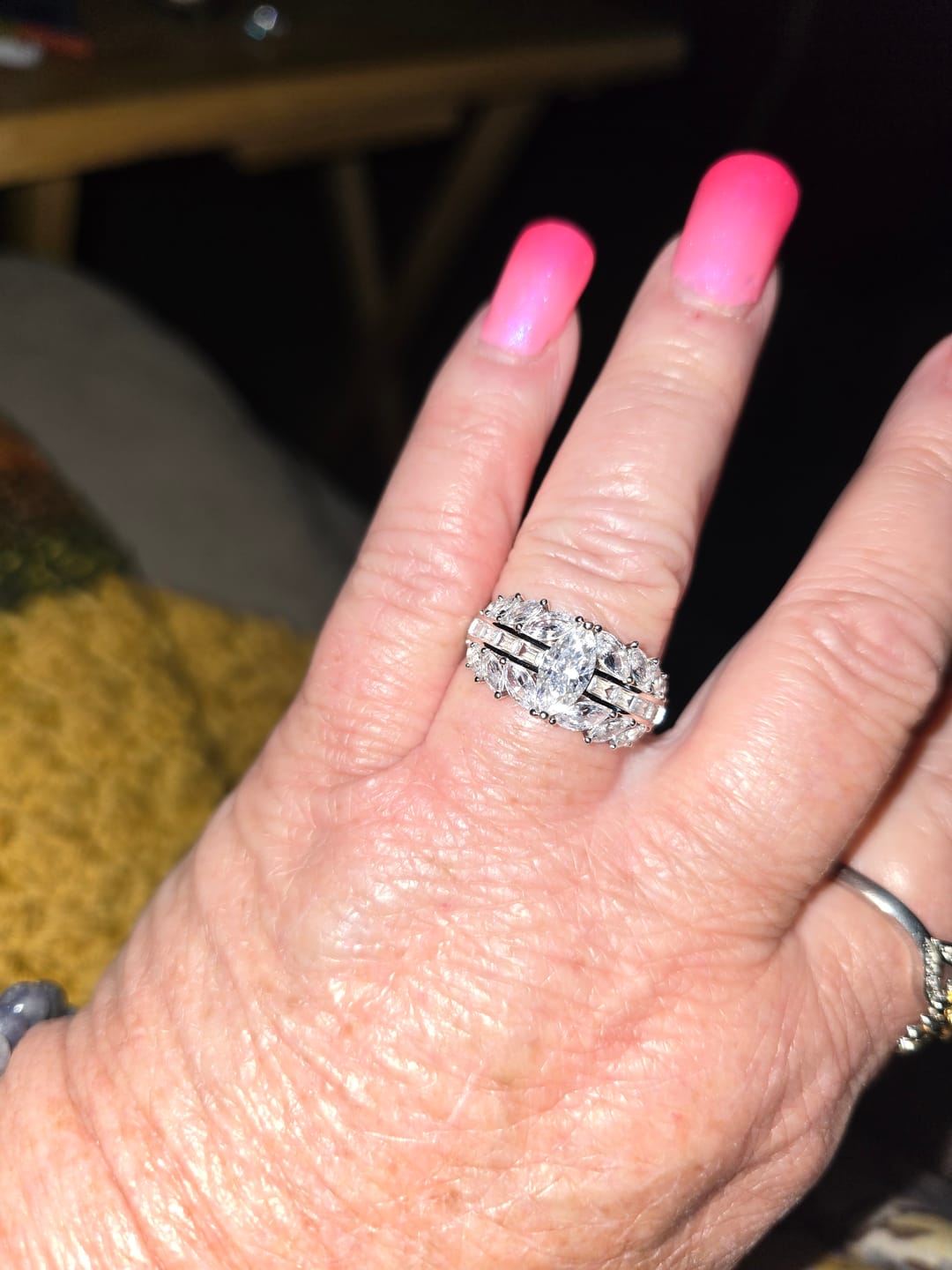 Customer photo review of Marquise Cut Moissanite And Enhanced Side Stone Engagement Ring