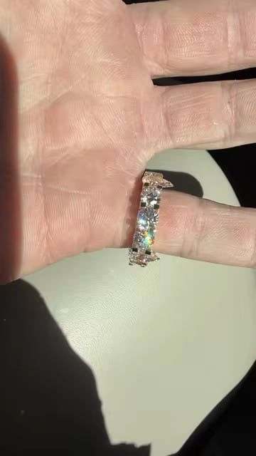 Customer photo review of 50 Pointer Round Mix Pear Cut Side Iced Eternity Ring Moissanite
