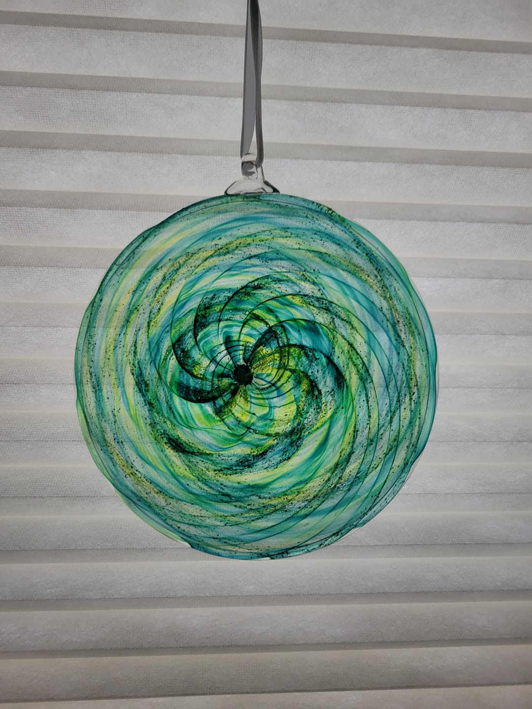 Customer photo review of Glass Disc Suncatcher with Cremation Ash
