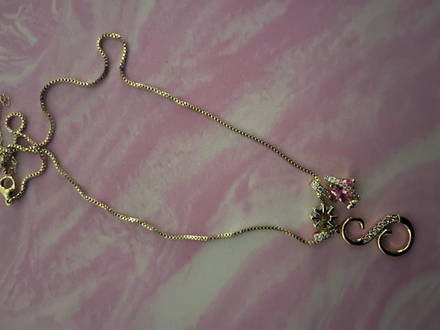 Customer photo review of Pink Planet Initial Necklace
