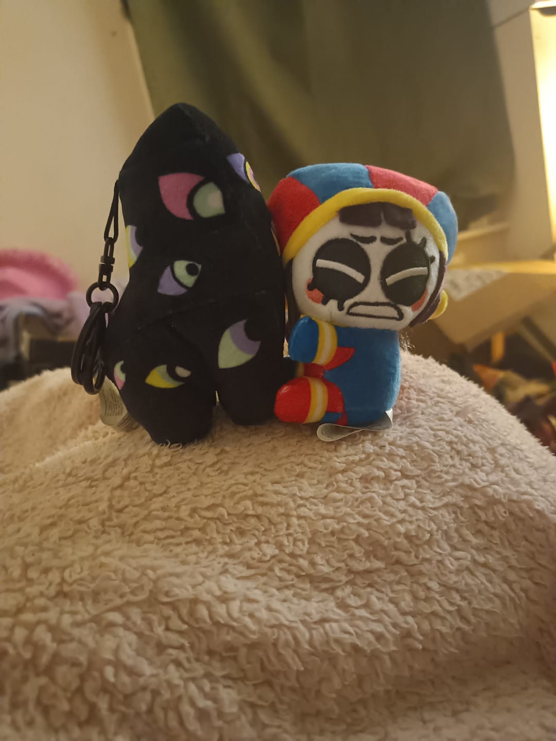 Customer photo review of Pomni & Abstraction Magnetic Plush Keychains