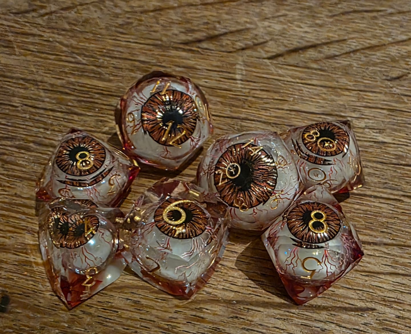 Customer photo review of URWizards D&D Eyes(Glow in the Dark) Liquid Core Dice Set Multi-faceted Style