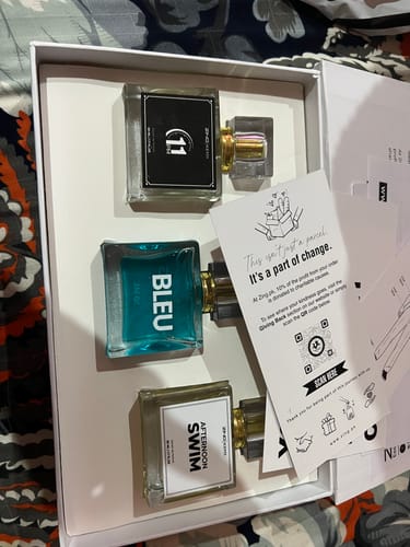 Customer's OUD Supreme BUNDLE showing three distinct perfume bottles inside the open white box.