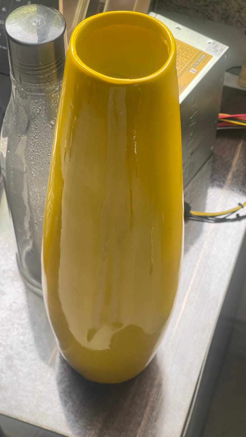 Customer photo review of Yellow Resin Vase Sculpture Vastu Remedy for Financial Stability, and Expenditure Control for SSW Direction Placement in Home, Office and Living Spaces | 8 x 37 cm | 600 gm