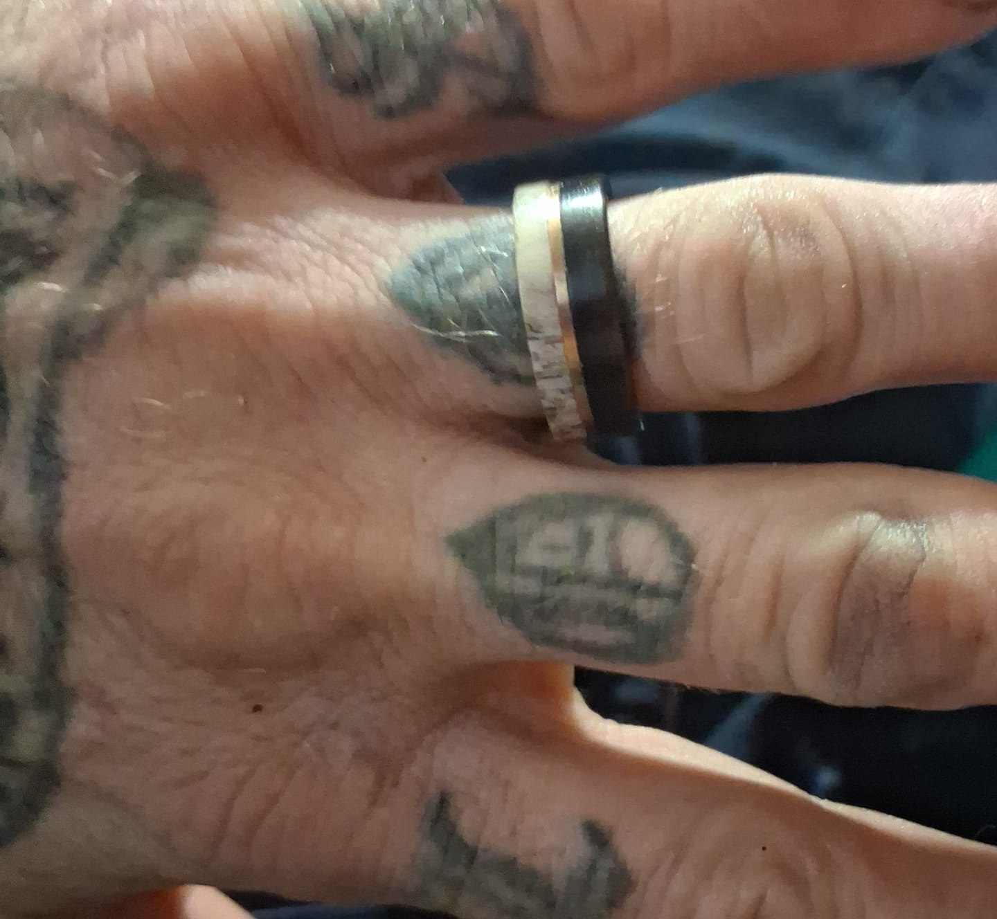 Customer photo review of 8mm- Brushed Finish Black Tungsten W/Raw Edge White Deer Antler Off-Center Rose Gold Stripe.