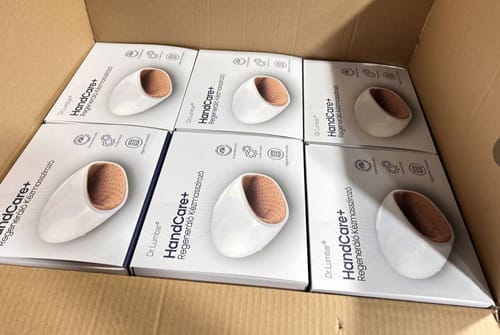 Reviewer's photo of multiple HandCare+ Regeneráló Kézmasszírozó product boxes packed inside a shipping carton.