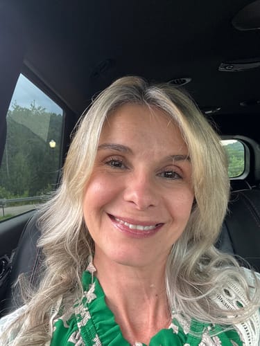Reviewer smiling, showing the firm skin results after using the Seranova Micro Infusion System.