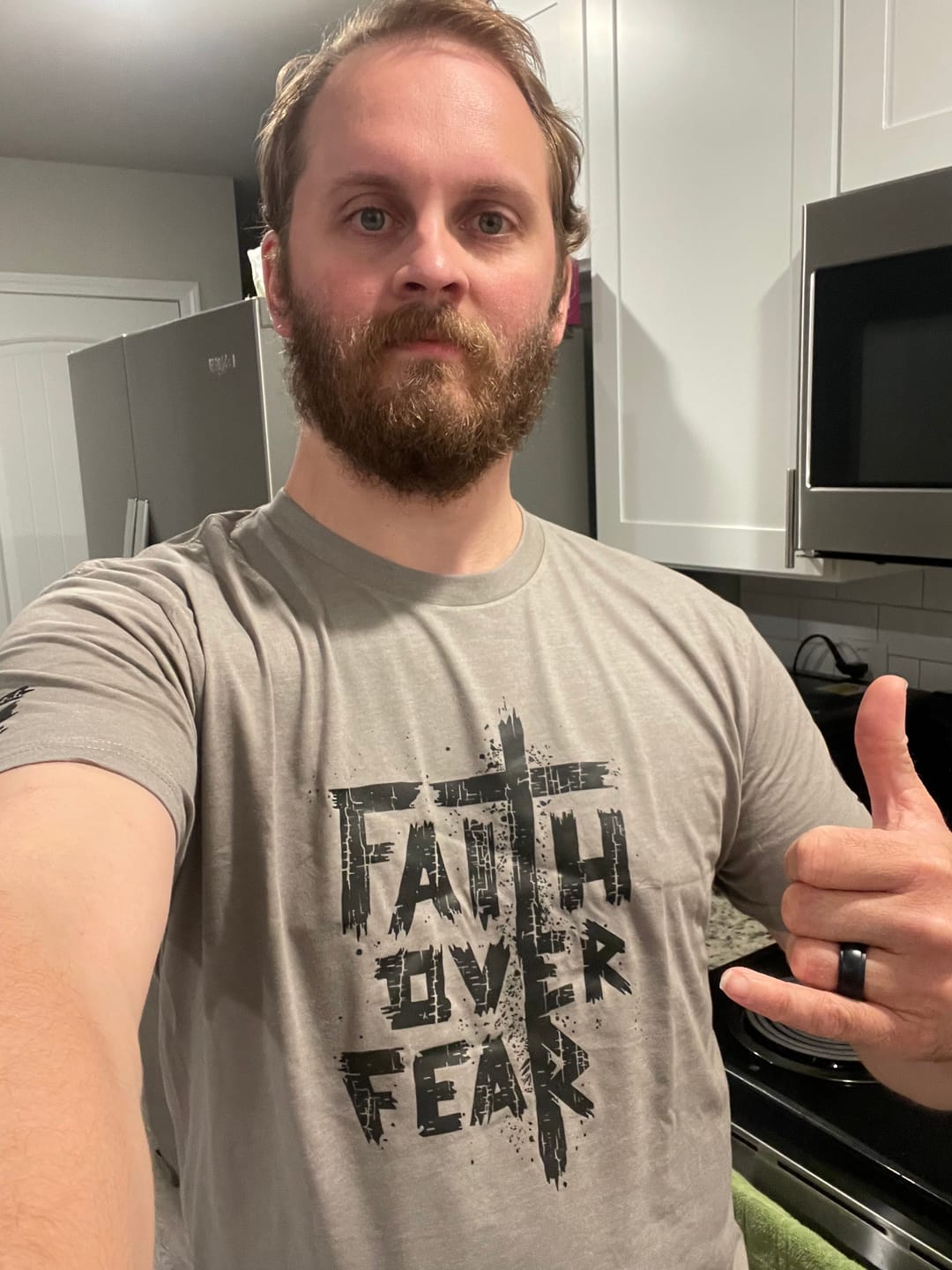 Customer photo review of Faith Over Fear Tee