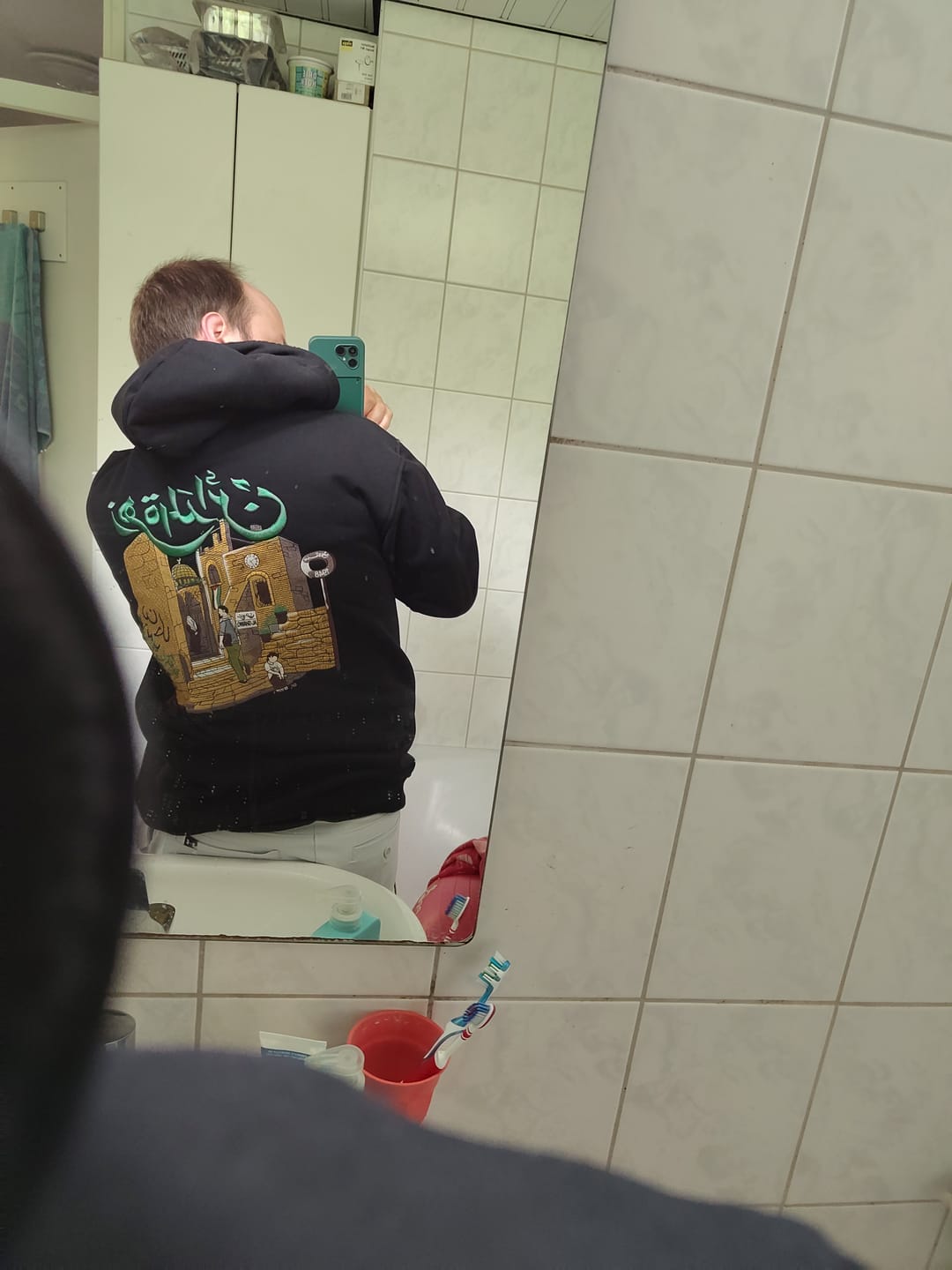 Customer photo review of Zahrat Al-Mada'en - زَهرة المدائِن Hoodie (Unisex)