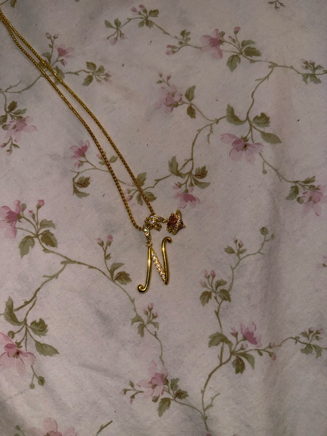 Customer photo review of Pink Planet Initial Necklace