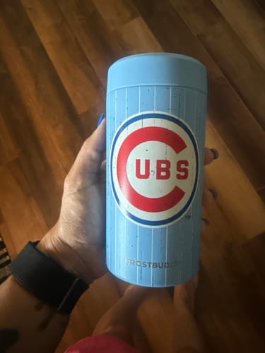 Reviewer holding the light blue Chicago Cubs Cooperstown Universal Buddy.