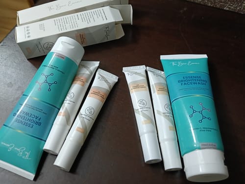 Customer's two tubes of Essence Brightening Facewash and four tubes of Lip Pigmentation Cream on a table.