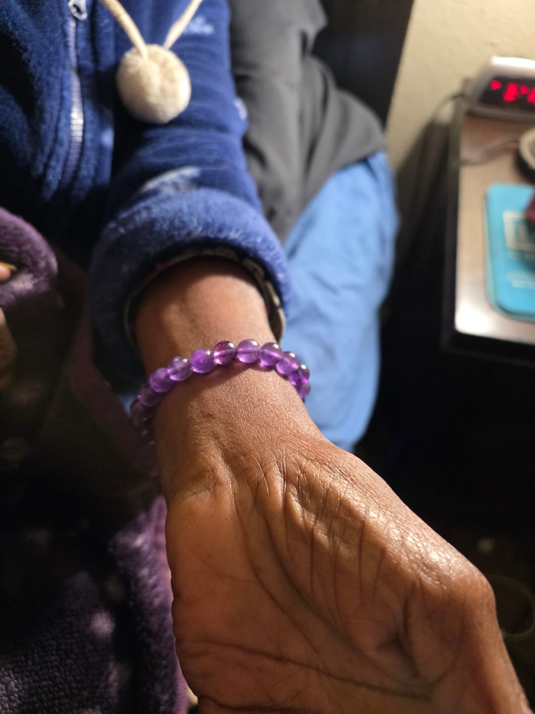 Customer photo review of Natural Amethyst Healing Bracelet – Genuine Purple Crystal Gemstone Jewelry for Calm, Protection & Emotional Balance