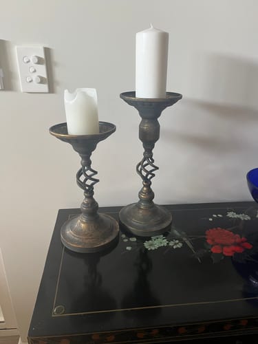 Customer's Michel French Provincial Candle Holder and shorter companion styled on a dark console table with white candles.