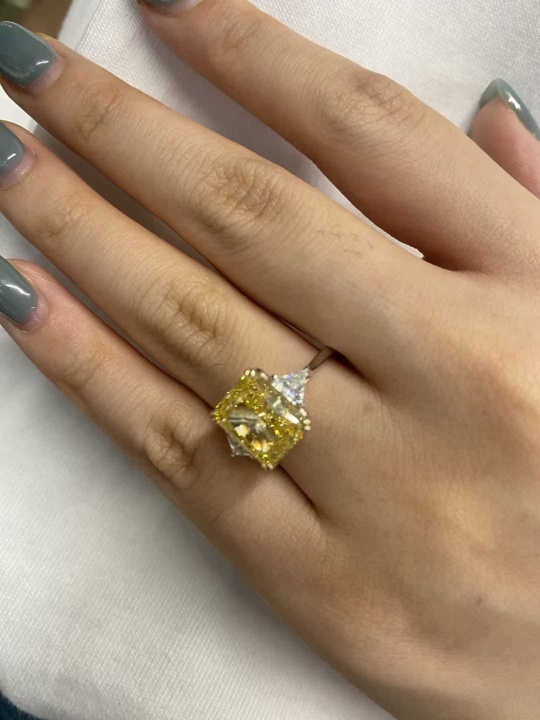 Customer photo review of S925 4.0Ct Radiant & Triangle Cut Yellow Stone Three Stone Engagement Ring In Sterling Silver