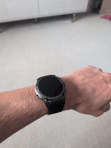 Reviewer showing their rugged, dark Gard Pro Ultra 3 smartwatch on their wrist.