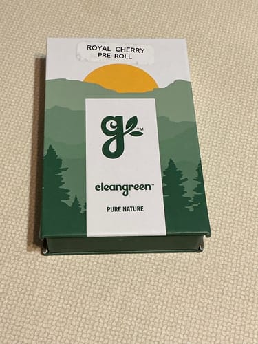 Customer's Royal Cherry Pre-Roll packaging featuring a forest illustration with a yellow sun on a white background