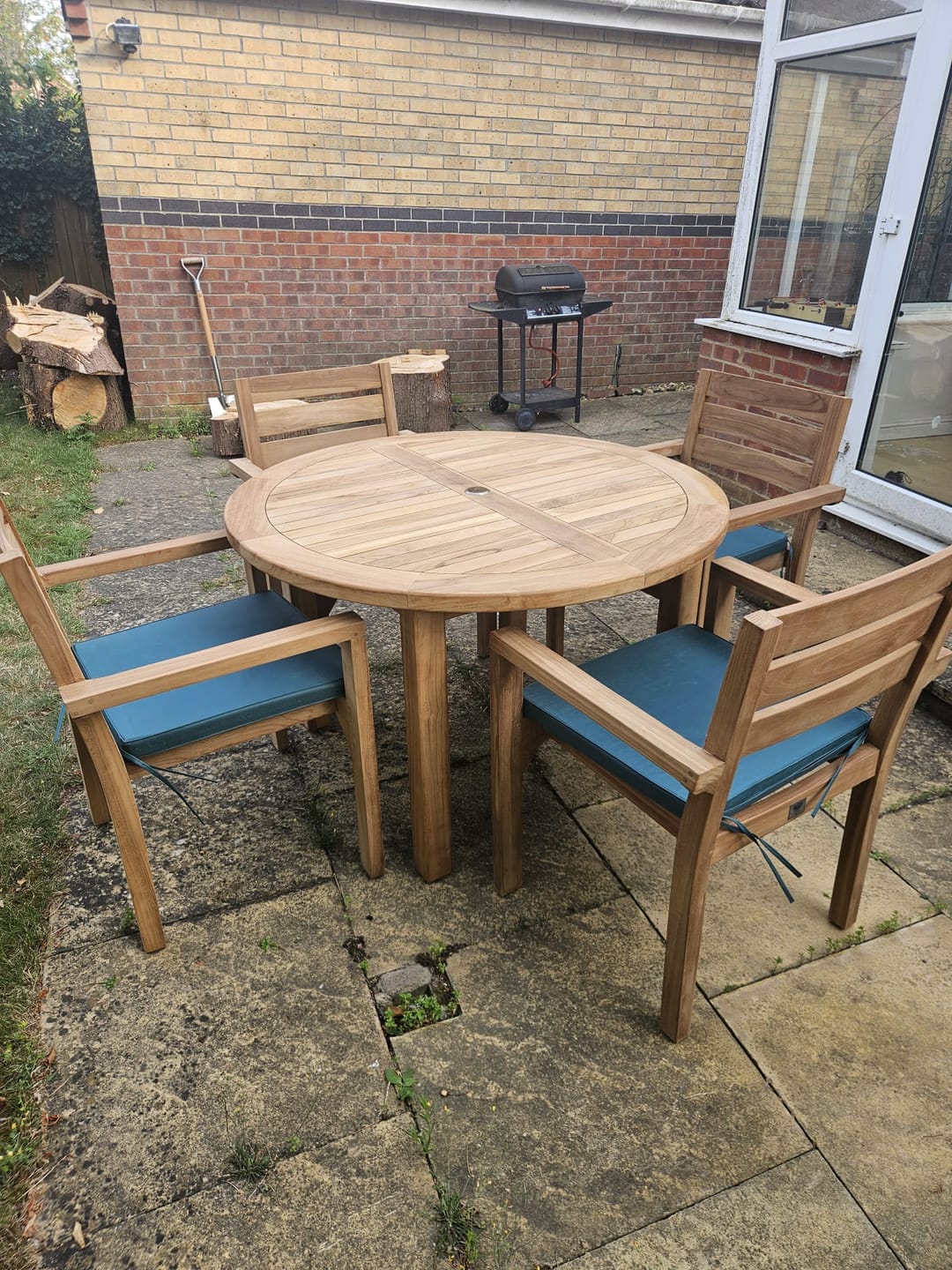 Customer photo review of 120cm Fixed Round Teak Garden Dining Set With 4 Marlow Stacking Chairs