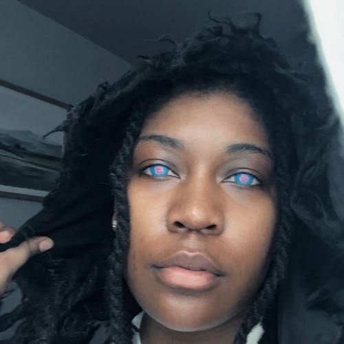 Customer's eyes wearing vibrant blue Hibana colored contact lenses for a cosplay look.