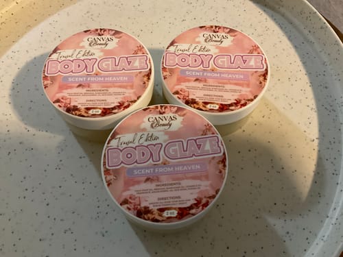 Customer's three travel-size jars of the Scent from Heaven Body Glaze on a speckled tray.