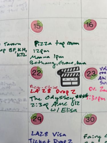 Reviewer's calendar page featuring a cute, black and white Movie Time! Planner Sticker of a film clapperboard.