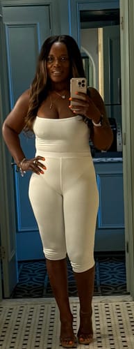 Customer's white Smooth Sculpt Waist Capri Leggings worn with a matching top in a mirror selfie.