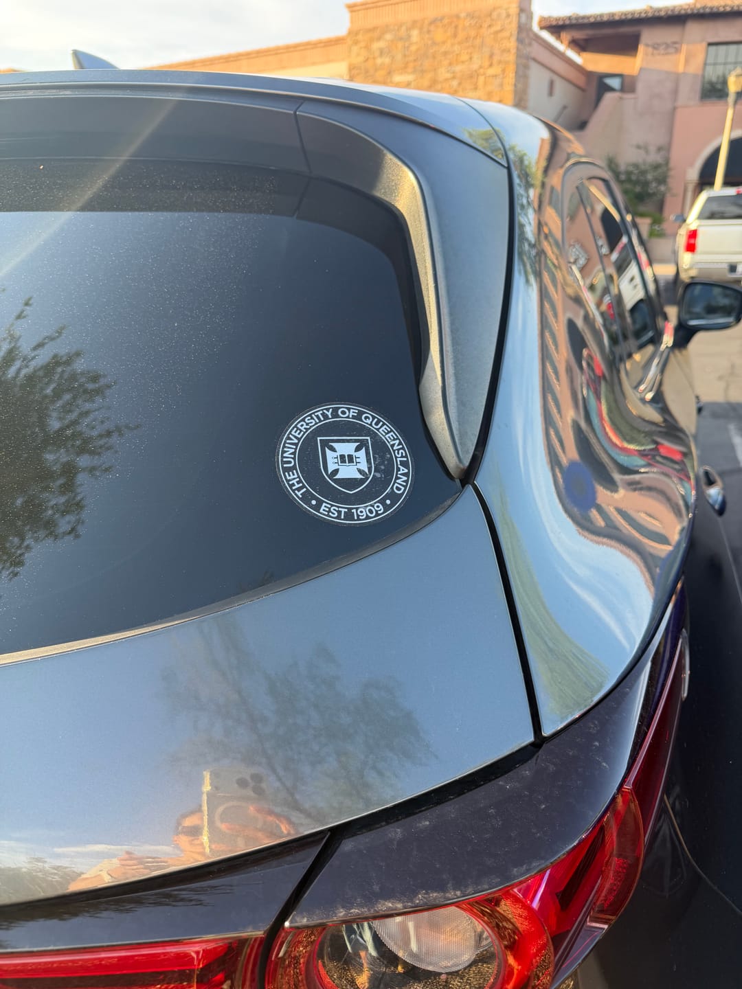 Customer photo review of UQ Shield Bumper Sticker - Rounded