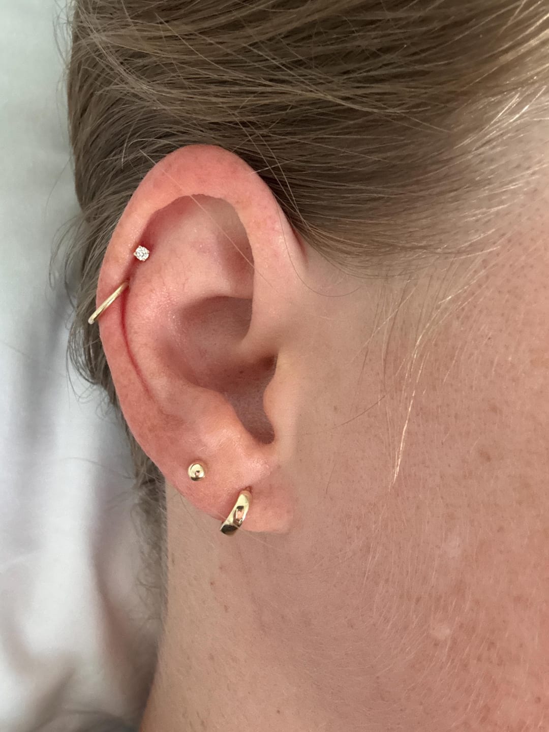 Customer photo review of Quiet Hold Huggie Earrings
