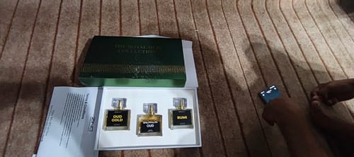 Customer's OUD Supreme Bundle perfume gift set open to reveal three small bottles and an instruction leaflet.