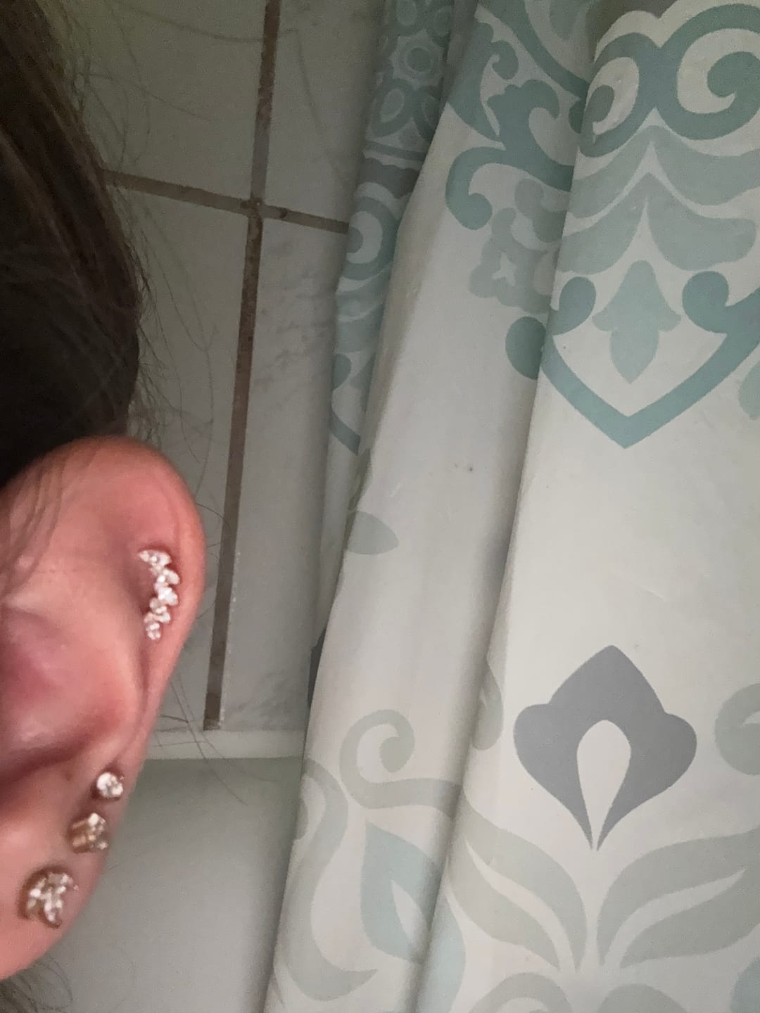 Customer photo review of Feather Piercing | Titan