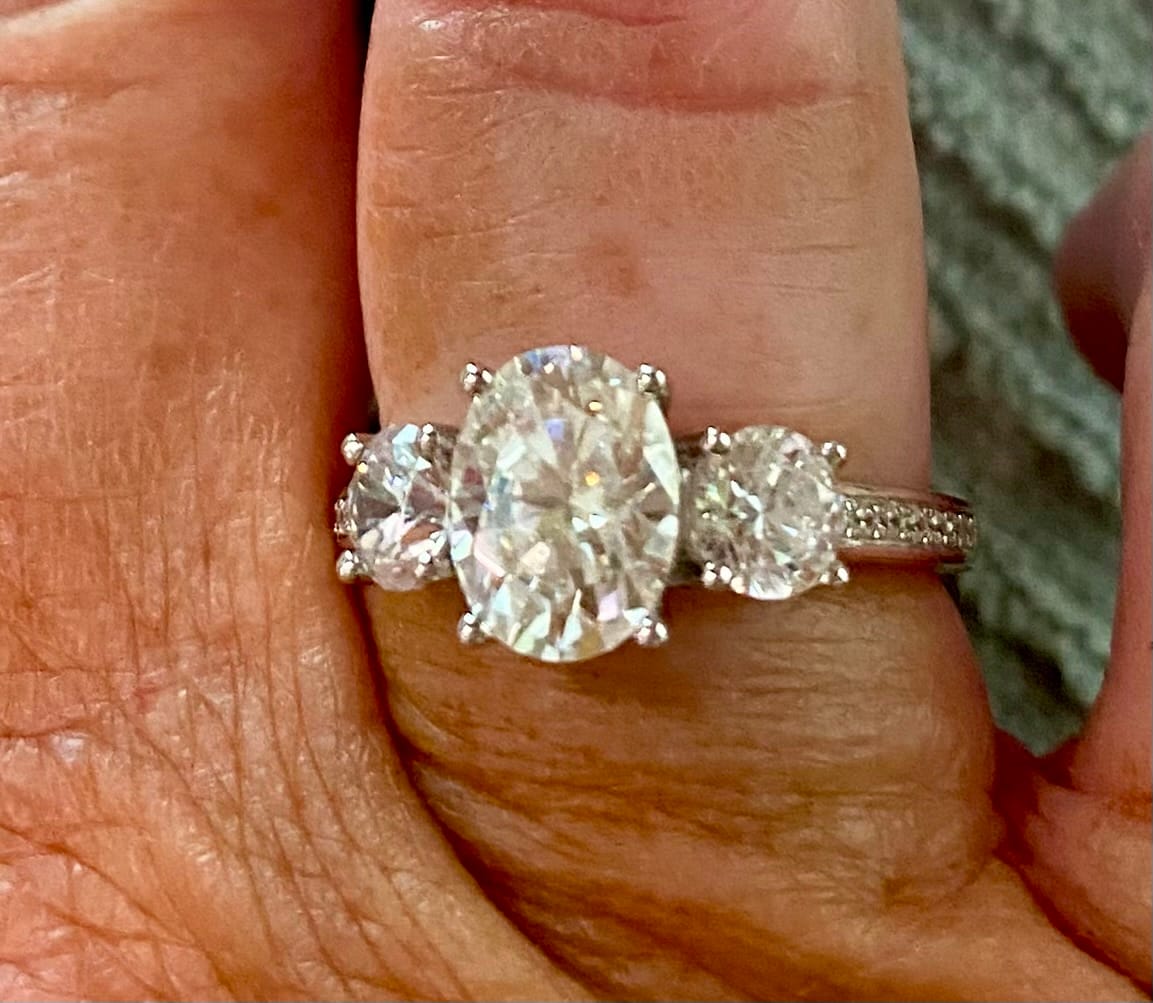 Customer photo review of Three Stone Oval Moissanite Channel-Set Engagement Ring