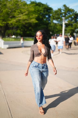 Customer's Naked Print Wire Crop Top in brown polka dot pattern styled with blue jeans.