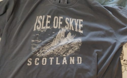 Customer's gray Isle of Skye Sketch T-Shirt featuring a graphic of the Old Man of Storr.