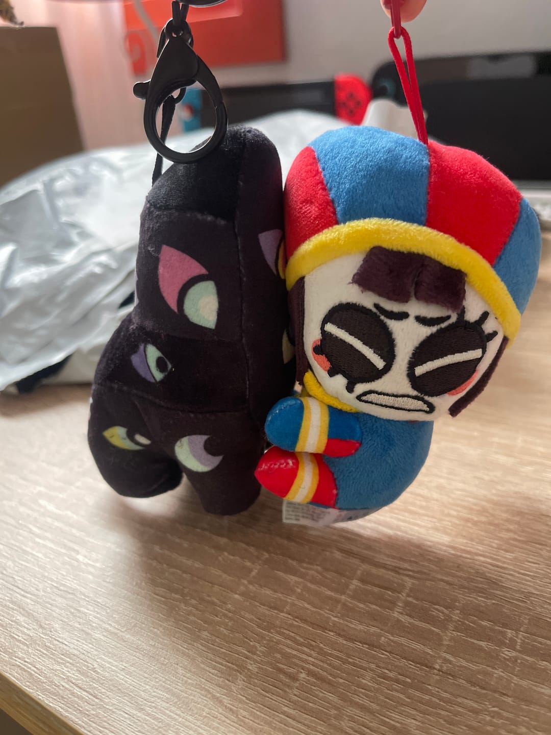 Customer photo review of Pomni & Abstraction Magnetic Plush Keychains