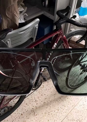 Customer cycling glasses with stick-on lenses