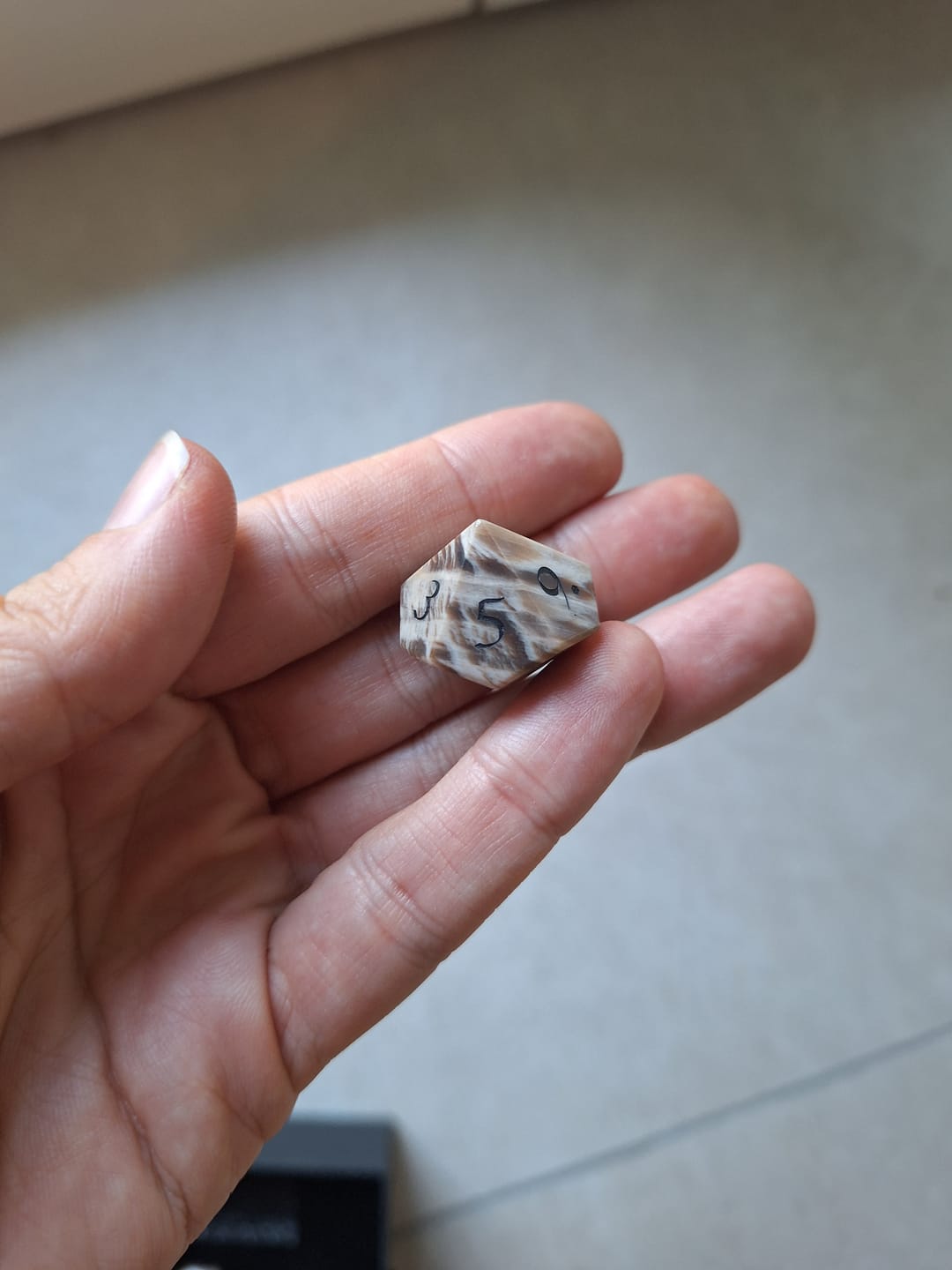 Customer photo review of URWizards D&D Petrified Wood Gemstone Engraved Dice Set(Limited edition)