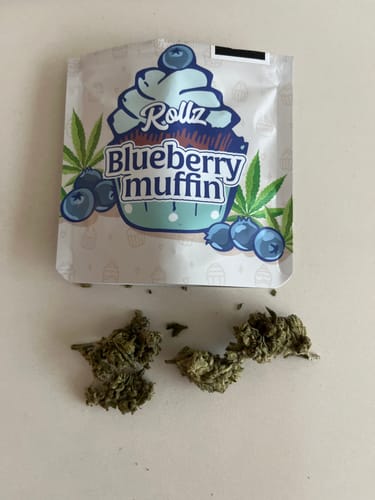Customer's Rollz Blueberry Muffin THC-A flower and packaging on a plain white surface.