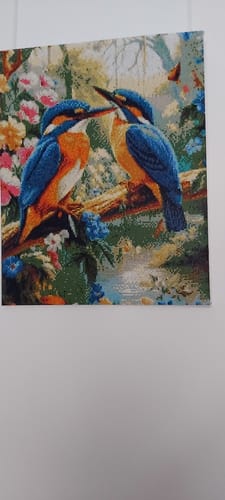 Reviewer's completed 2 Eisvögel diamond painting, showing two colorful birds perched on a branch surrounded by flowers.