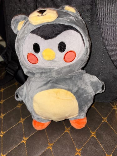 Customer's gray Finch plush toy with yellow belly and orange feet from their review.