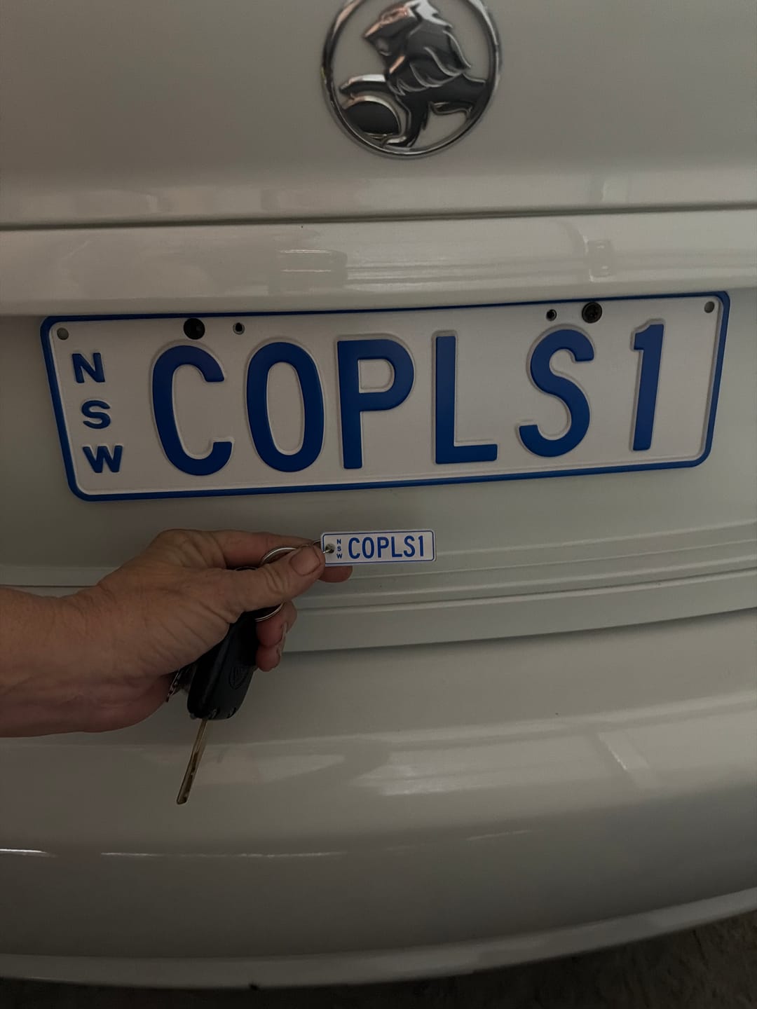Customer photo review of NSW Colour on White Licence Plate Custom Keychain