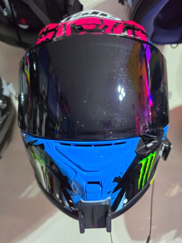 Customer's HJC RPHA 1/1N Camera Mount installed on a blue and black patterned motorcycle helmet.