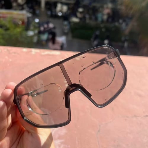 Customer wearing glasses with stick-on vision lenses outdoors
