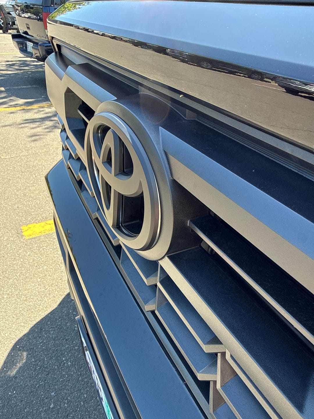 Customer photo review of NEW 2024-2026 Tacoma Matte Blackout Overlay Front Grille Emblem