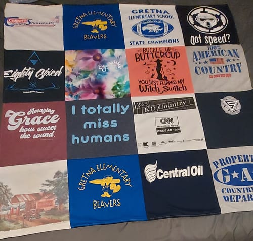 Customer's Project Repat T-Shirt Quilt featuring a colorful collage of various graphic t-shirt squares.